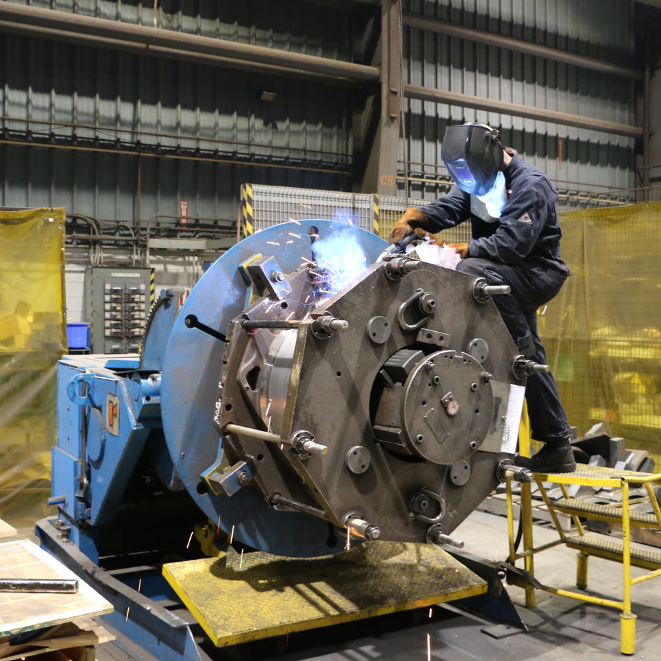 Production Associate performing tie in welds on an AC Frame at the Piper Lane Location in London Ontario.