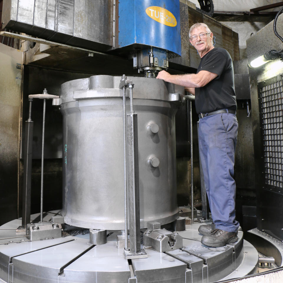 CNC Machinist on Toshiba Lathe Machine indicating a casting for the mining industry.