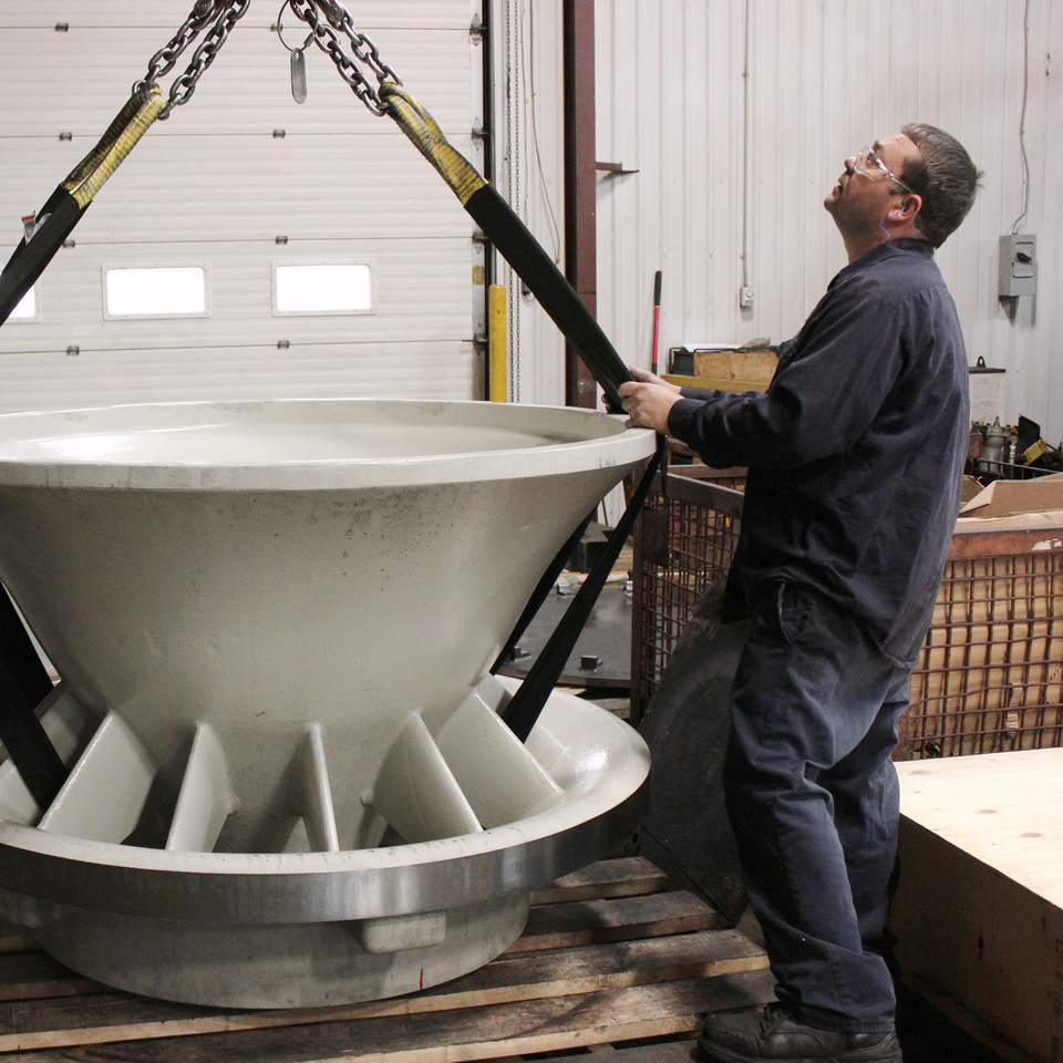 CNC Machinist using a crane to rig and move a large Air Inlet at the Sovereign Road location. Paul with crane and part! Wont let me copy and paste this picture.