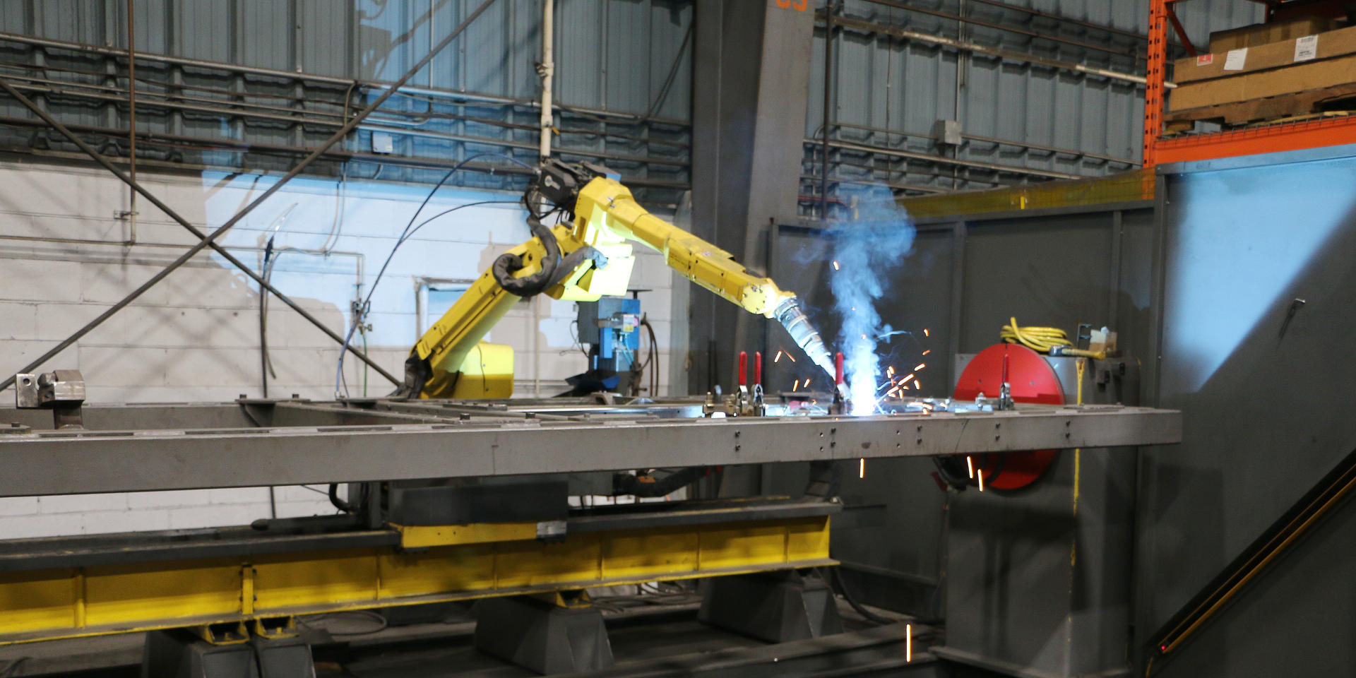 A Motofil Flex Welding Robot welding together side sheet components of a Gear Case at ADJ Industries Piper Lane Location.